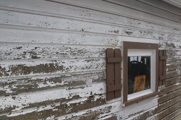 Severely deteriorated exterior lead-based paint New Jersey home