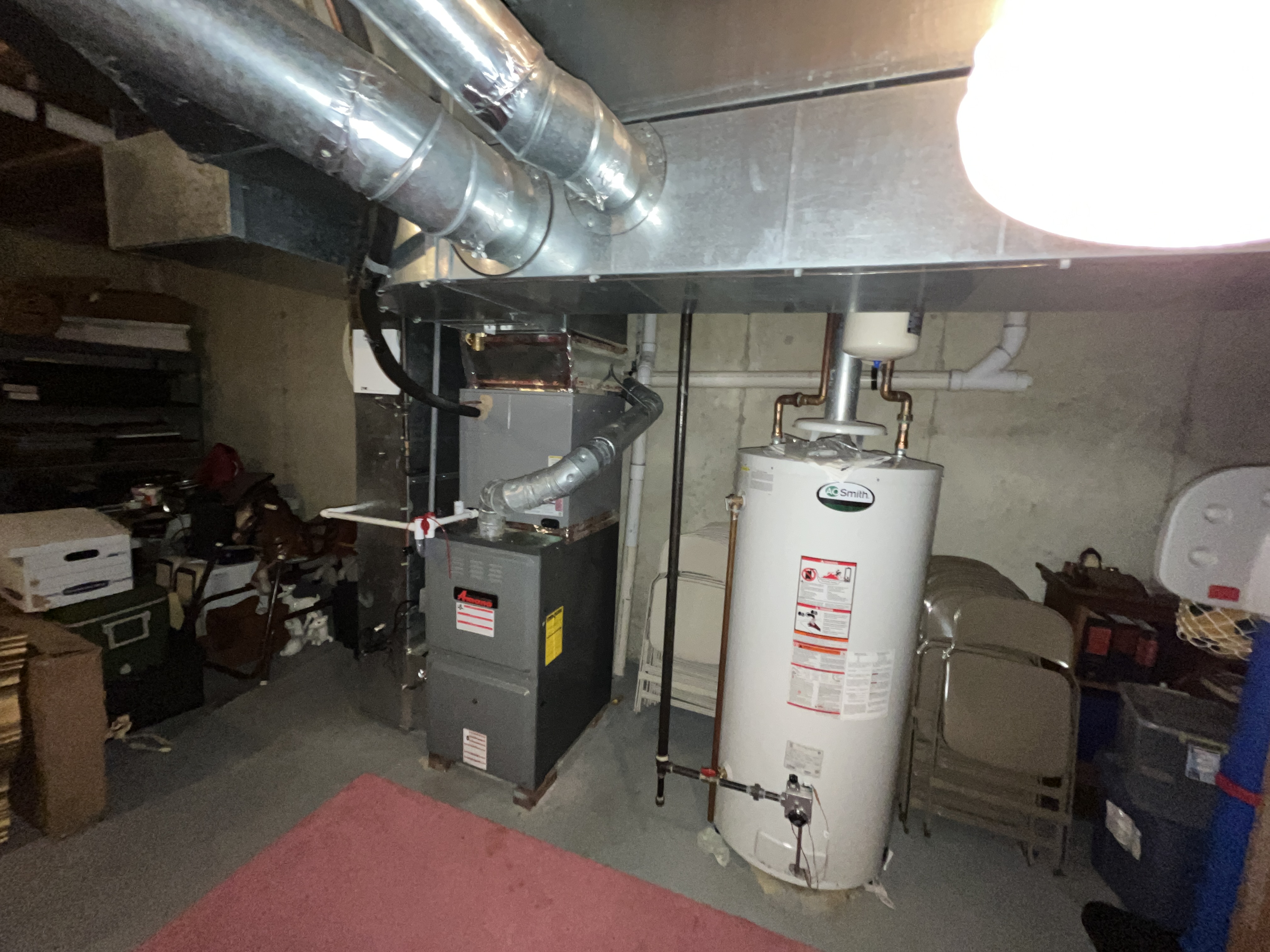 Gas water heater and furnace venting system in New Jersey basement