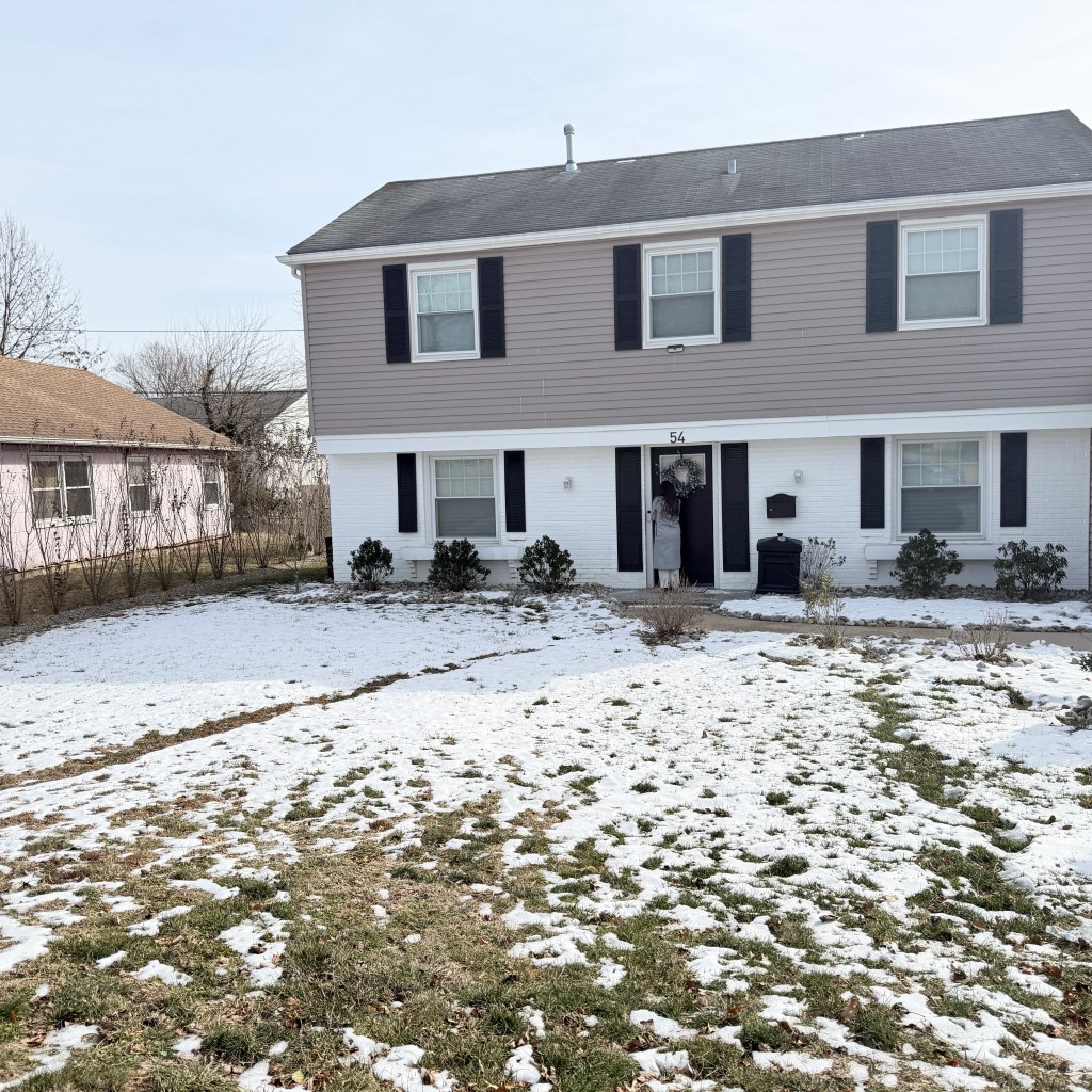 Snow-covered yard and home exterior in New Jersey during winter inspection