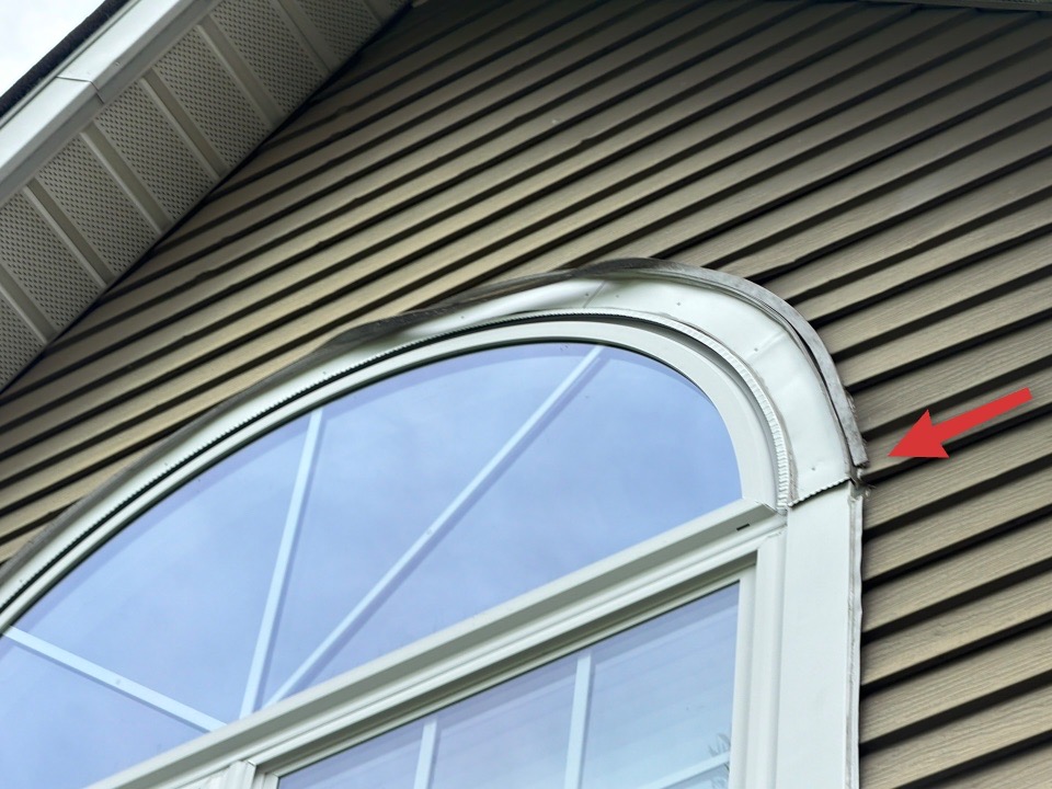 Displaced window trim and siding creating an opening for water intrusion during a New Jersey home inspection.