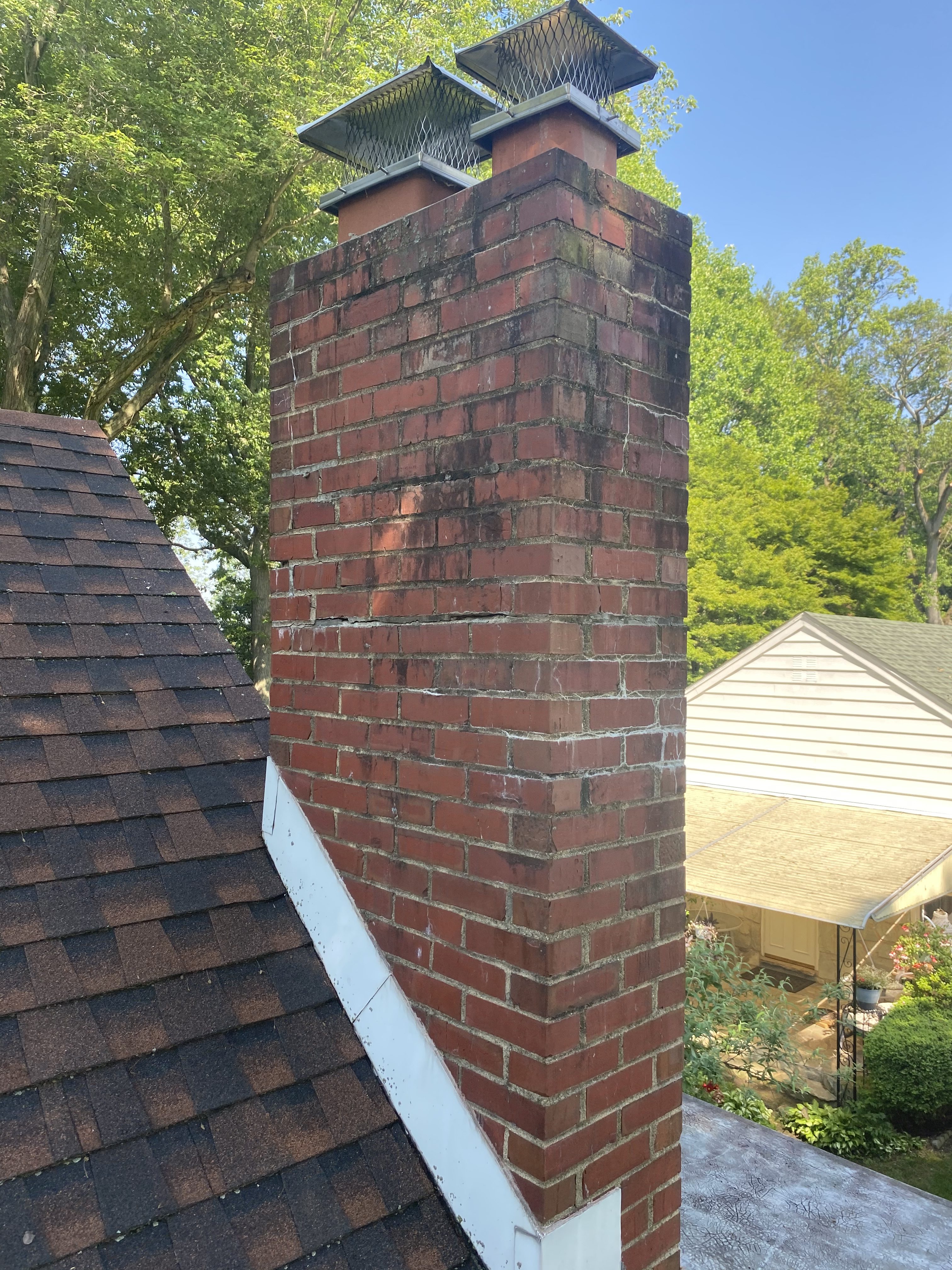 Masonry chimney being evaluated during a New Jersey chimney inspection
