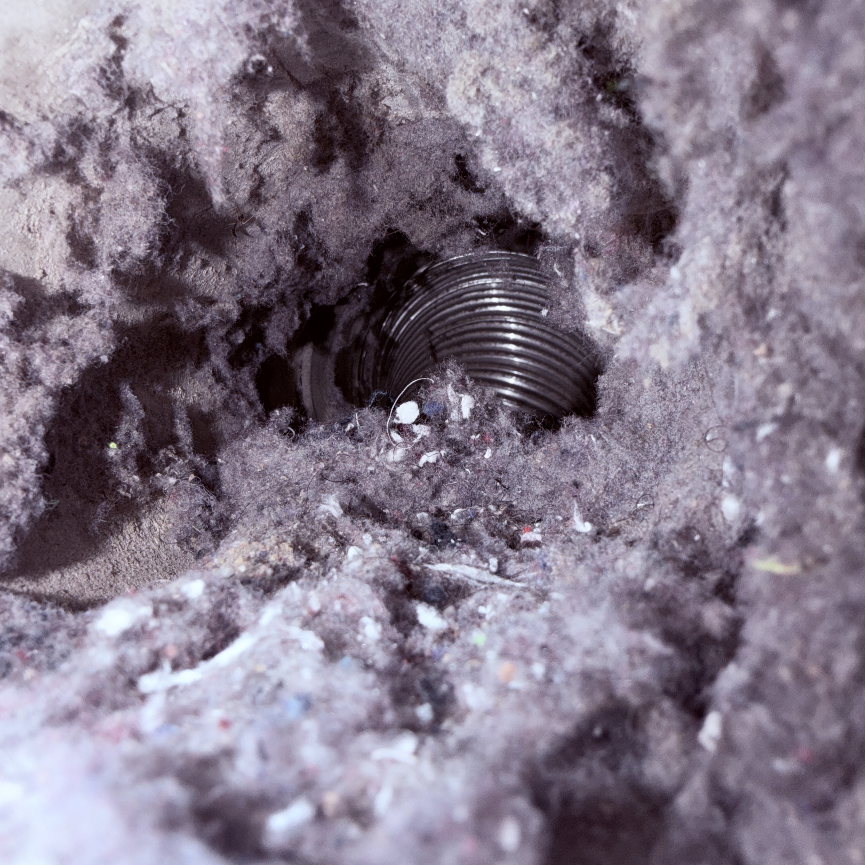 Heavy lint accumulation observed at a residential dryer exhaust system